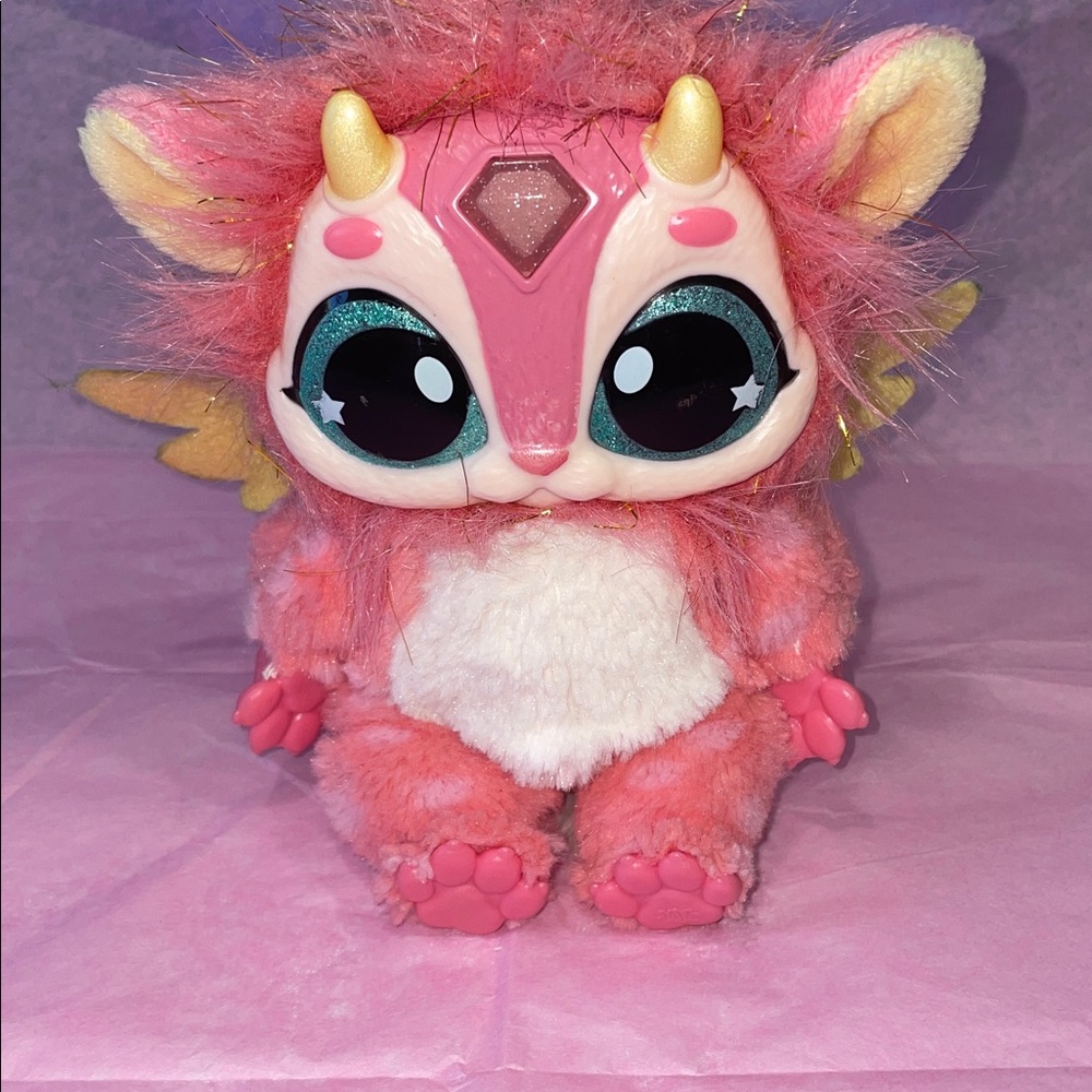 Pink and Gold Plush Creature with Big Eyes